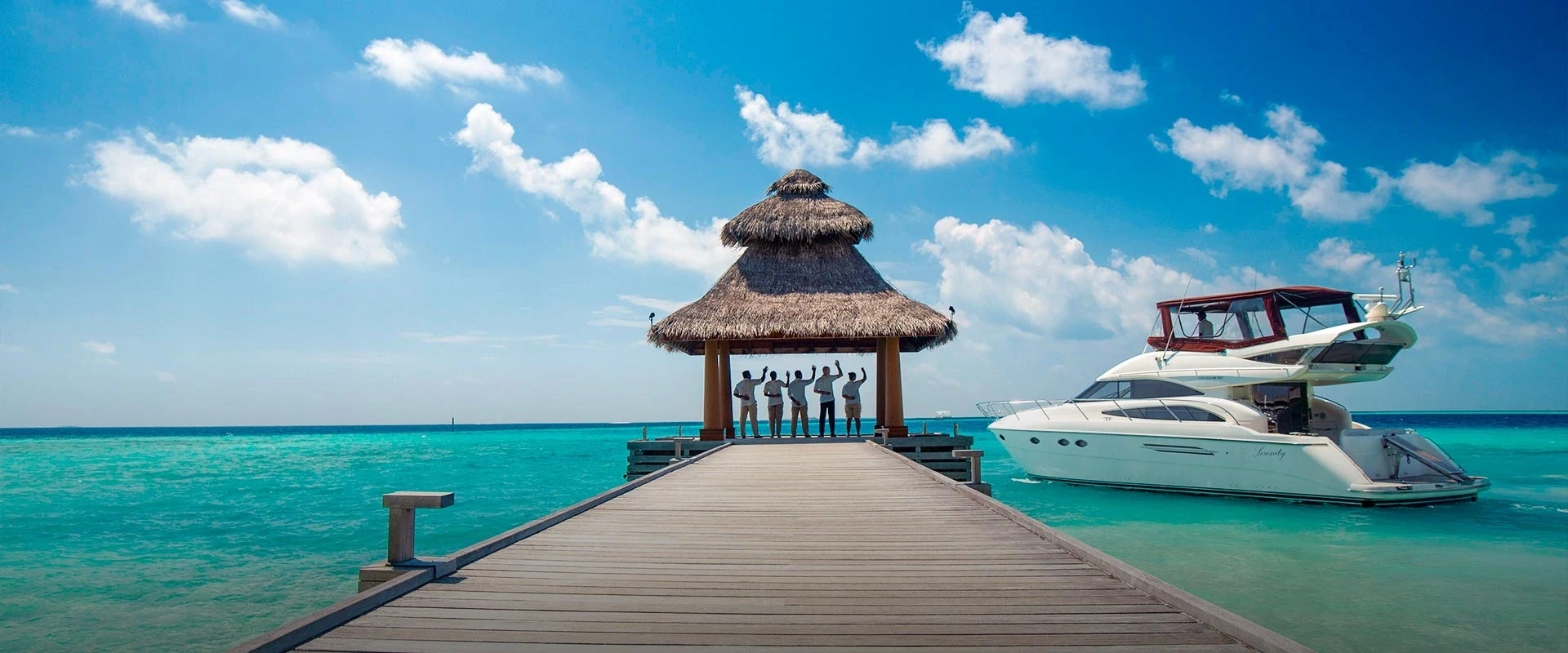 Baros jetty and private yacht in the turquoise lagoon