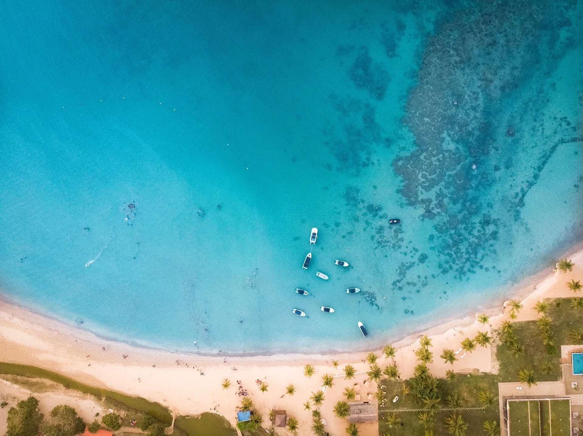 Aerial view of blue water and sand at Pasikudah