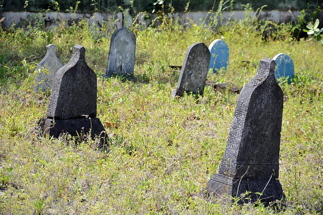 Period tombstones in the old cemetery at Utheemu.